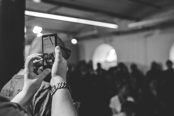 kaboompics.com_Woman taking a photo with cell phone _ bw.jpg Kaboompics com Woman taking a photo with cell phone bw